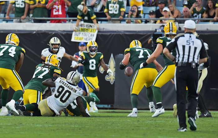Saints defensive end Tanoh Kpassagnon (90) causes a fourth quarter fumble by Green Bay Packers quarterback Jordan Love (10). © Bob Self/Florida Times-Union via Imagn Content Services, LLC